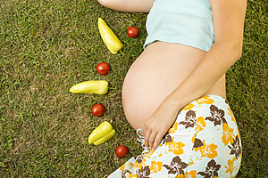 fruit around a pregnant woman